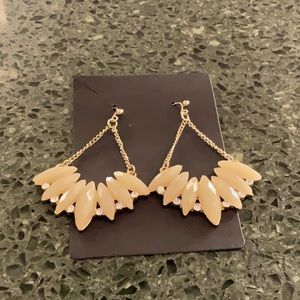 Statement cream earrings.